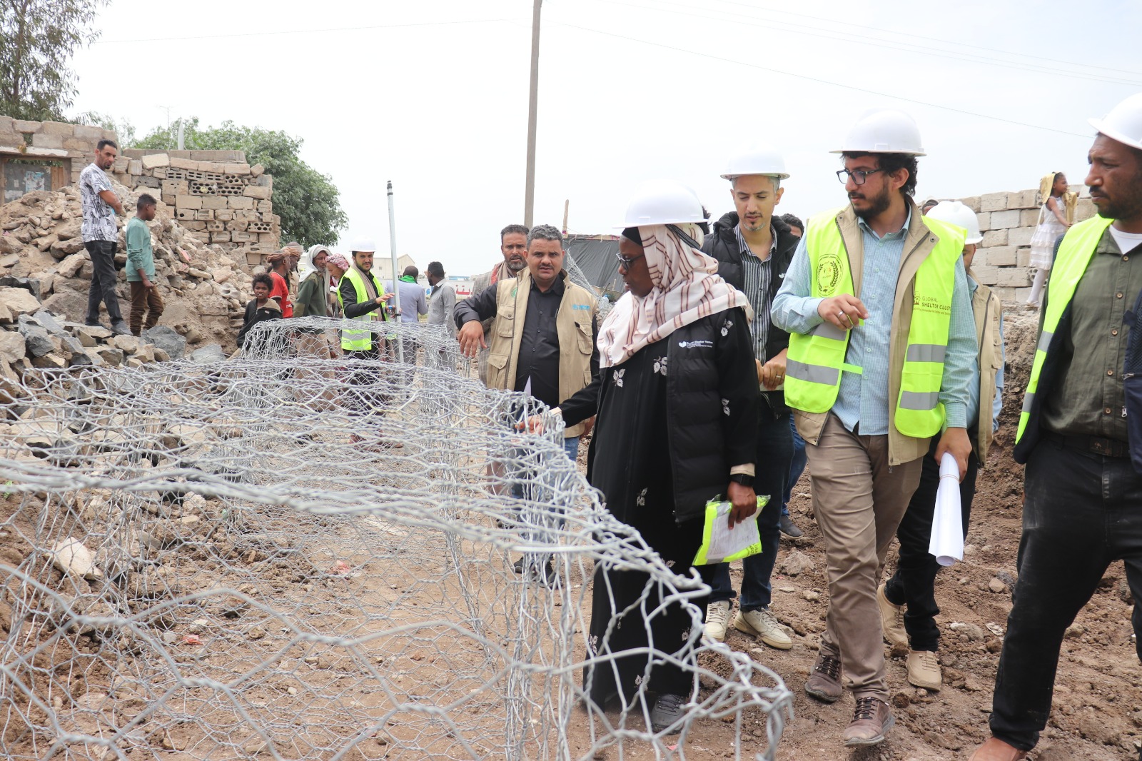 تدشن الـ (YGUSSWP) مشروع "بناء القدرة على الصمود" لمواجهة الفيضانات في موقع خط المائة للنازحين بدعم من كتلة المأوى العالمية (GSC) والمفوضية السامية للأمم المتحدة لشؤون اللاجئين (UNHCR)